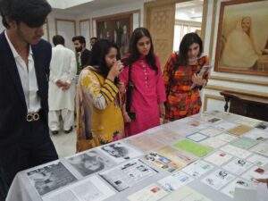 Participants view different books on the life of Iqbal
